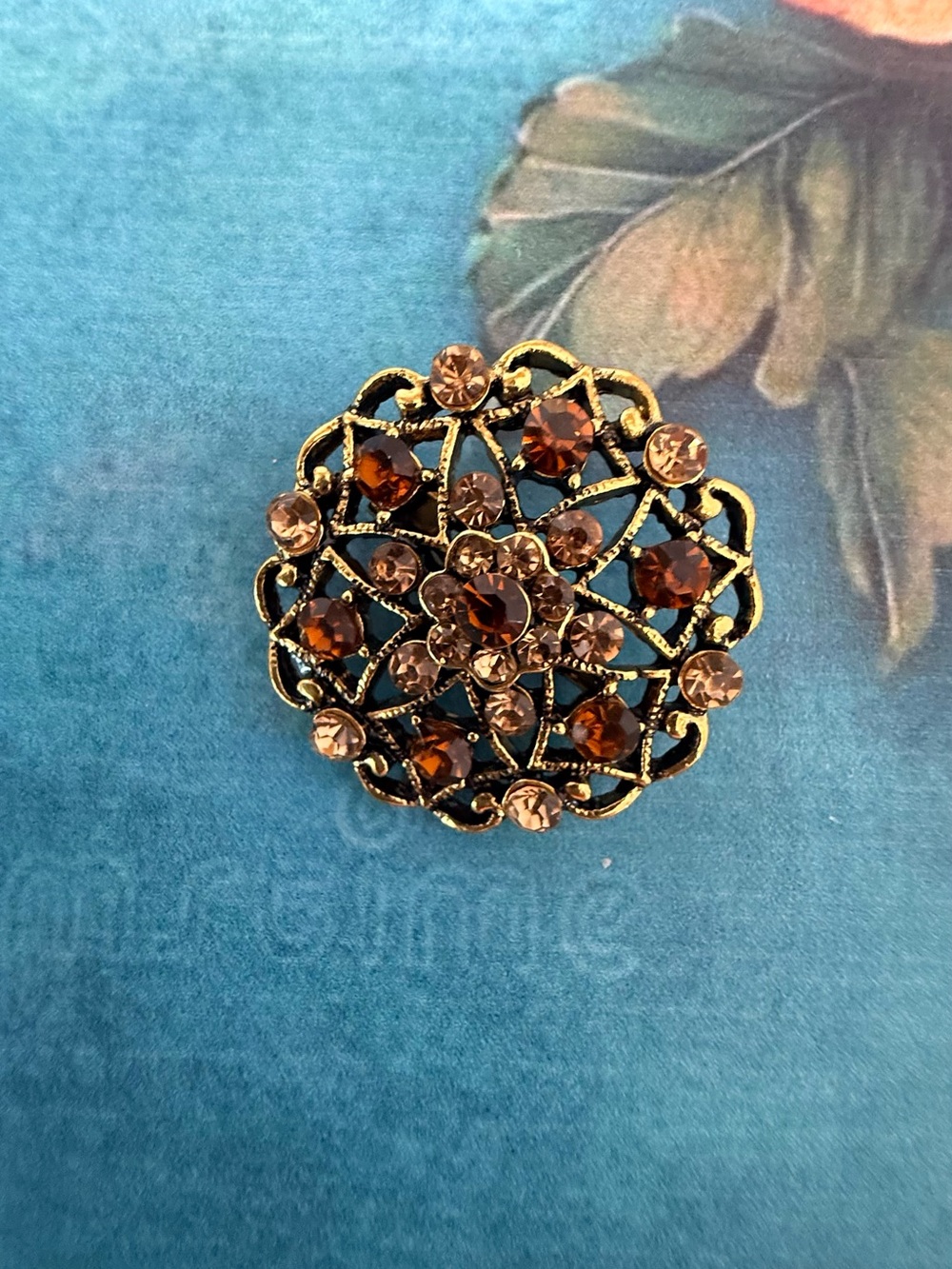 Vintage-Inspired Gold Filigree Brooch with Amber and Brown Crystals